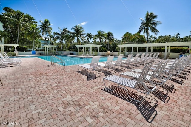 view of swimming pool featuring a pergola and a patio area