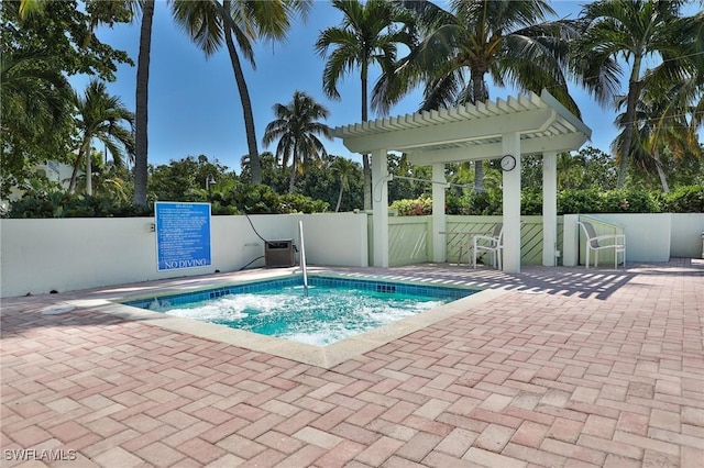 view of pool with a community hot tub and a pergola