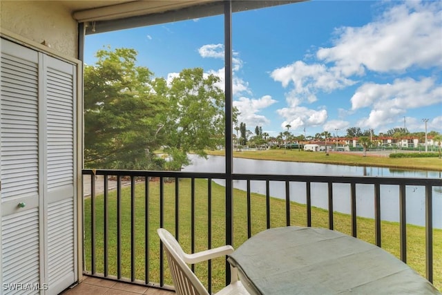 balcony featuring a water view