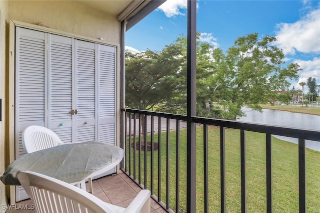 balcony featuring a water view