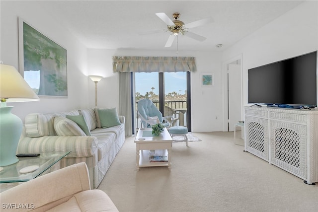 living room featuring ceiling fan and light carpet