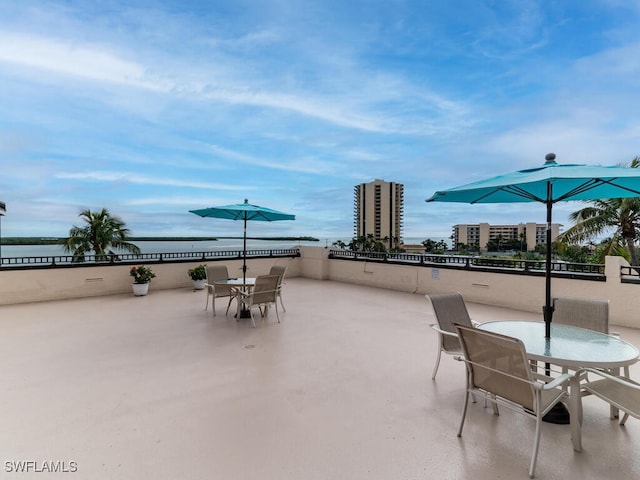 view of patio with a water view