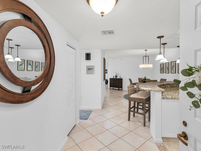 hallway featuring light tile patterned flooring