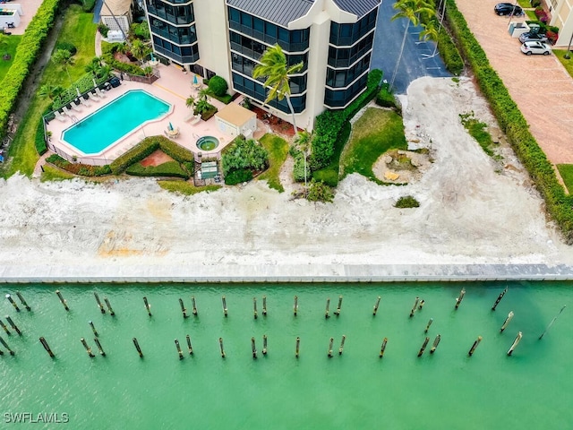 birds eye view of property with a water view