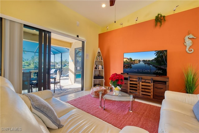 tiled living room featuring vaulted ceiling