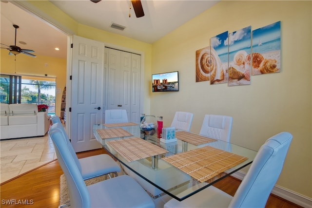 dining room featuring hardwood / wood-style flooring and ceiling fan