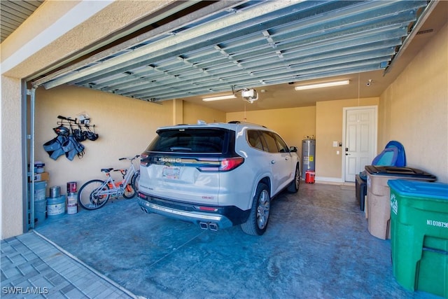 garage featuring a garage door opener and water heater