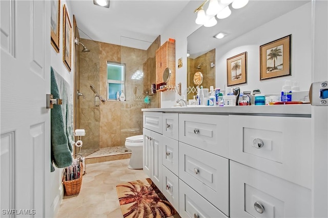 bathroom featuring double vanity, toilet, and walk in shower