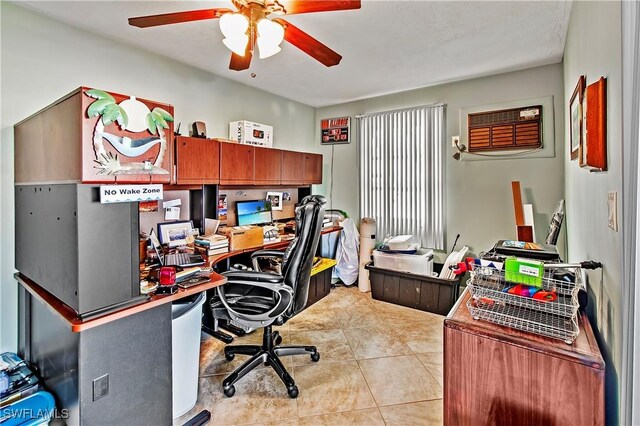 office space featuring ceiling fan, light tile patterned flooring, and a wall mounted AC