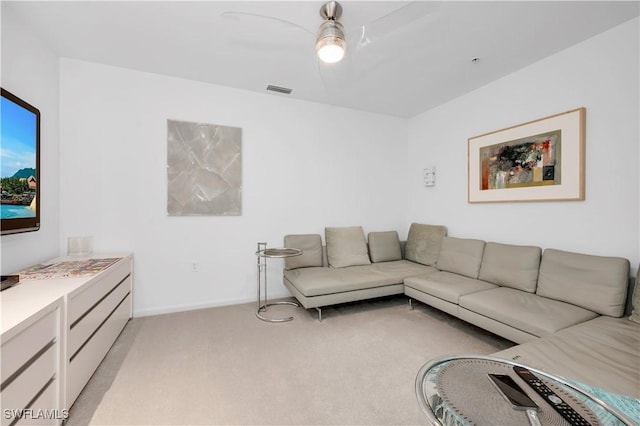 carpeted living room featuring ceiling fan