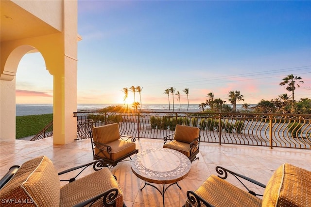 patio terrace at dusk with a water view