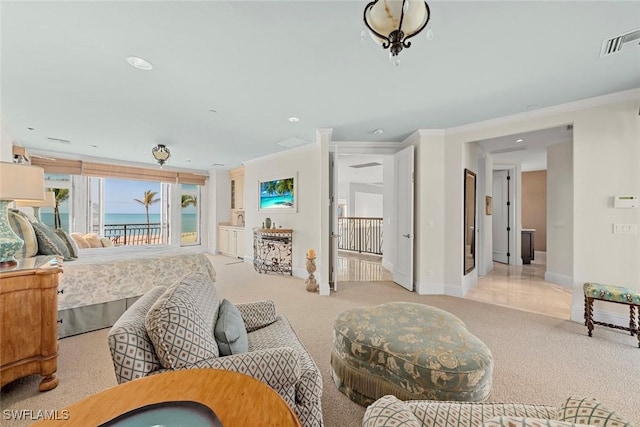 carpeted bedroom with crown molding and a water view