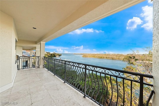 balcony featuring a water view