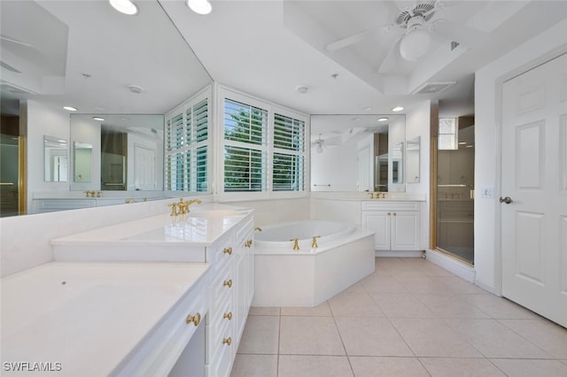 bathroom with tile patterned floors, vanity, a raised ceiling, ceiling fan, and plus walk in shower