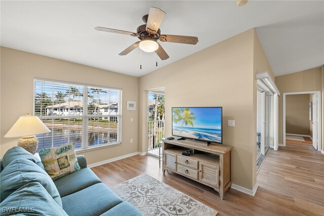 living room featuring light hardwood / wood-style flooring and ceiling fan