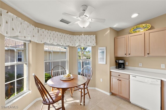 dining space with ceiling fan and light tile patterned floors