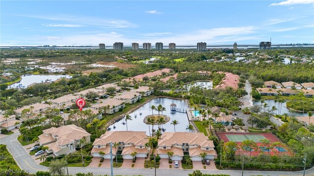 birds eye view of property with a water view