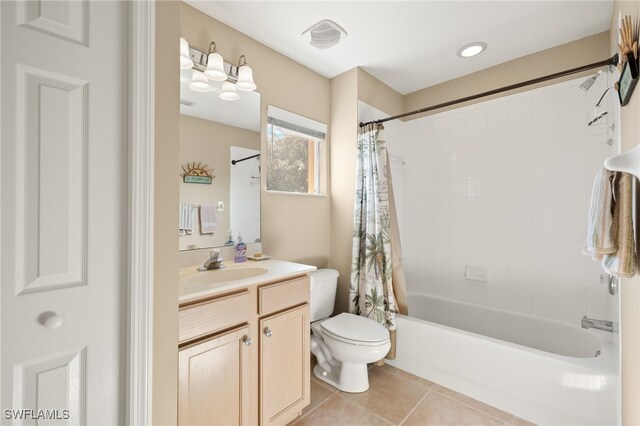 full bathroom featuring vanity, toilet, tile patterned floors, and shower / tub combo with curtain