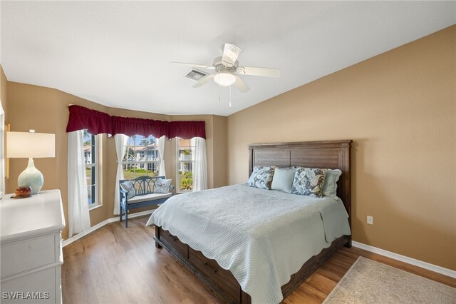 bedroom featuring ceiling fan and hardwood / wood-style flooring