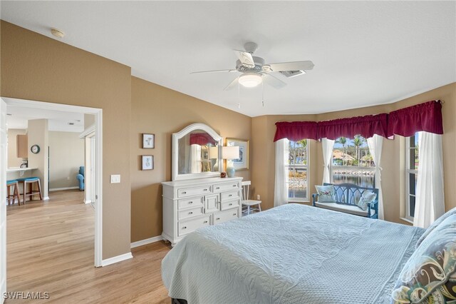 bedroom featuring ceiling fan and light wood-type flooring