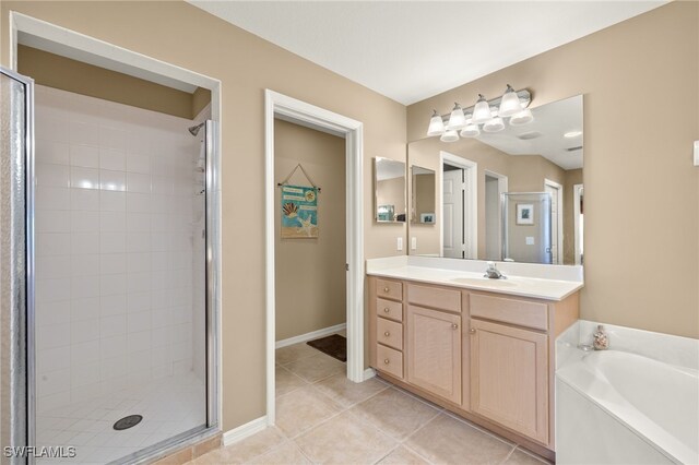 bathroom featuring vanity, tile patterned floors, and plus walk in shower