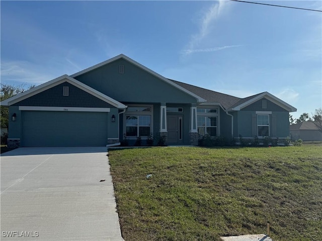 view of front of home featuring an attached garage, a front lawn, concrete driveway, and stucco siding