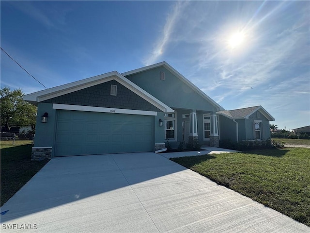 single story home with an attached garage, driveway, a front lawn, and stucco siding