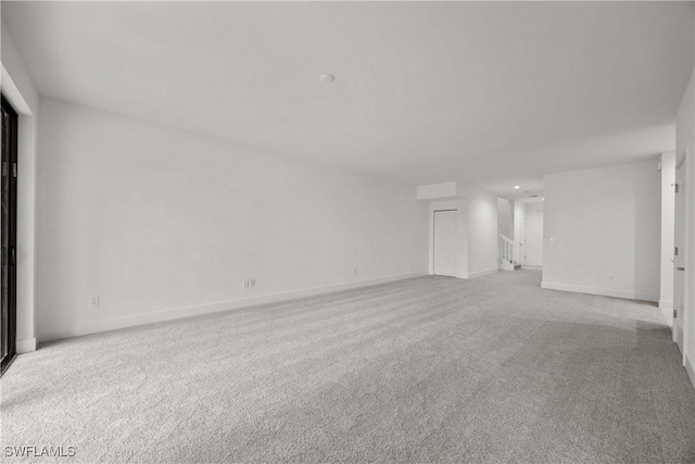 unfurnished living room with light carpet