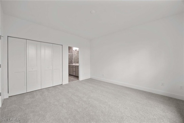 unfurnished bedroom featuring light colored carpet