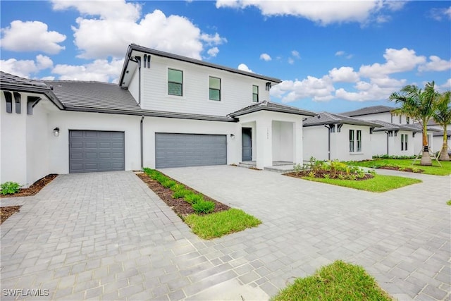 view of front of property featuring a garage