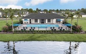 back of house featuring a patio area, a lawn, a community pool, and a water view