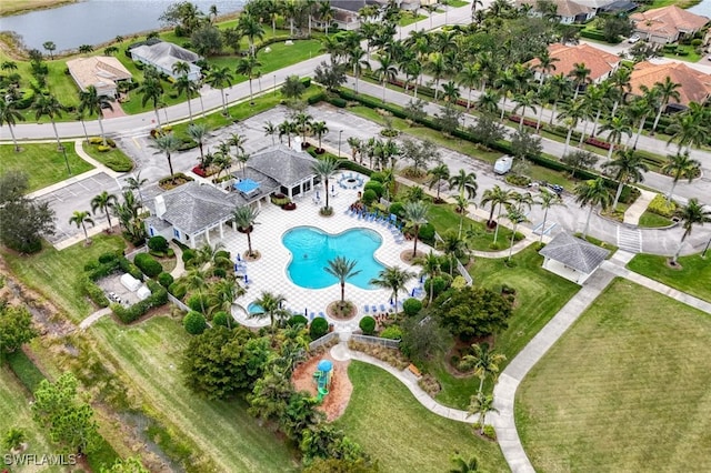 birds eye view of property with a water view