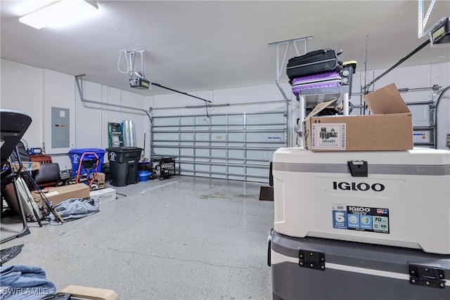 garage with a garage door opener and electric panel