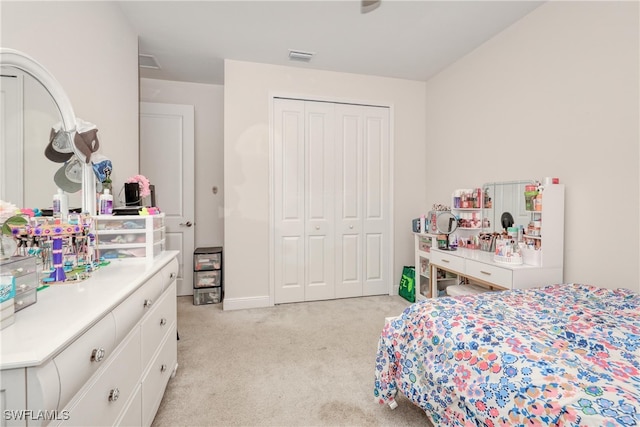 carpeted bedroom with a closet