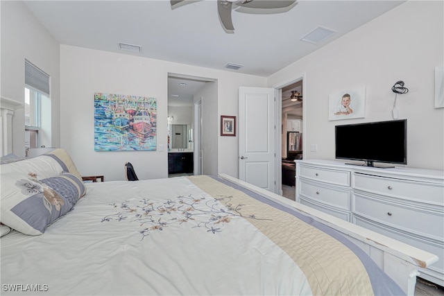 bedroom with ceiling fan and connected bathroom