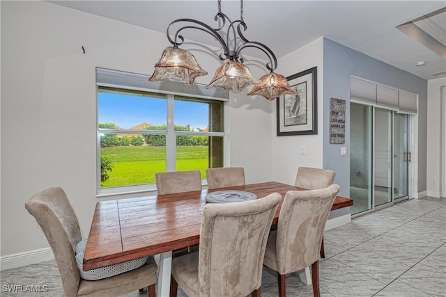 dining room with a notable chandelier