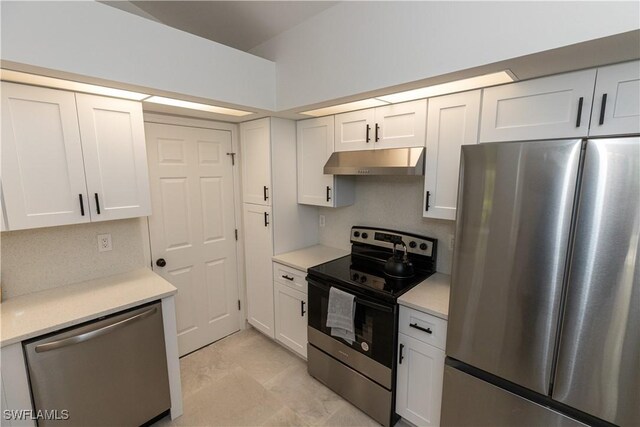 kitchen featuring under cabinet range hood, white cabinetry, appliances with stainless steel finishes, and light countertops