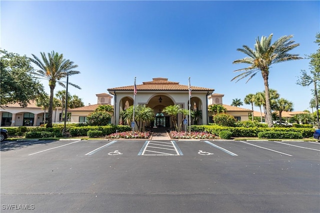 view of property featuring uncovered parking