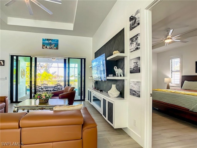 living room featuring a raised ceiling