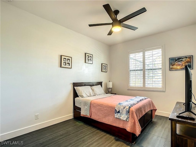 bedroom featuring ceiling fan and dark wood-type flooring