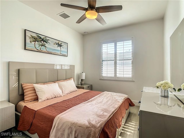 bedroom featuring wood-type flooring and ceiling fan