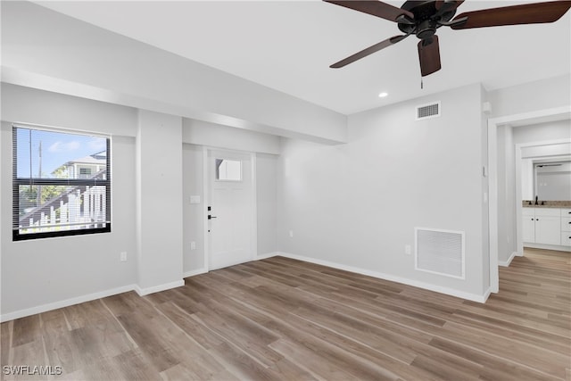 interior space featuring ceiling fan and light wood-type flooring