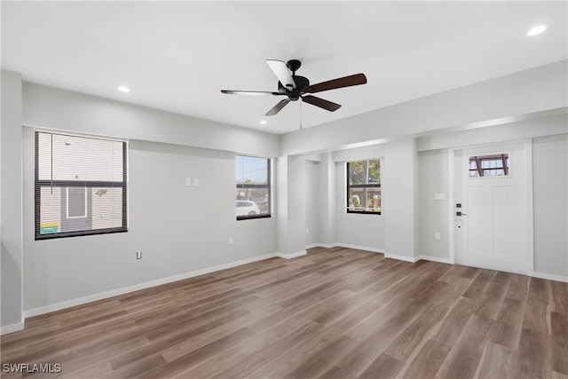 interior space featuring ceiling fan and wood-type flooring