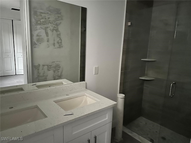 bathroom with vanity and walk in shower