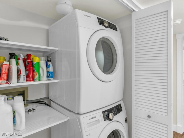 laundry room featuring stacked washer / dryer