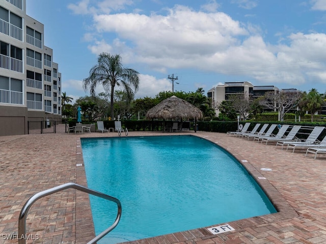 view of swimming pool featuring a patio area and a gazebo