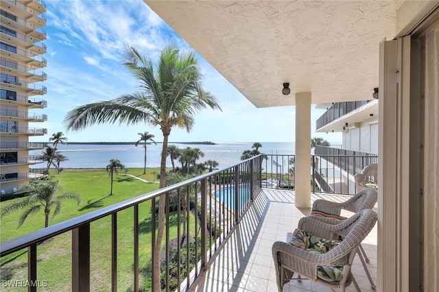 balcony featuring a water view