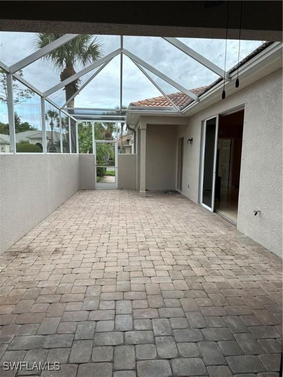 view of patio / terrace with a lanai