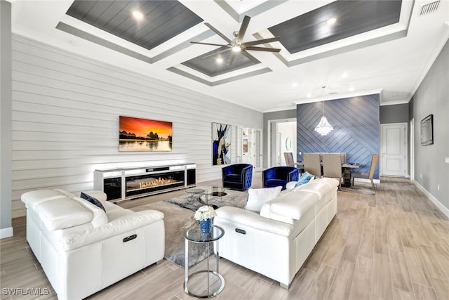 living room featuring crown molding, coffered ceiling, ceiling fan, and light hardwood / wood-style floors