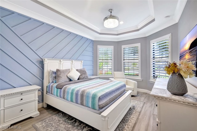 bedroom featuring light hardwood / wood-style flooring and ornamental molding